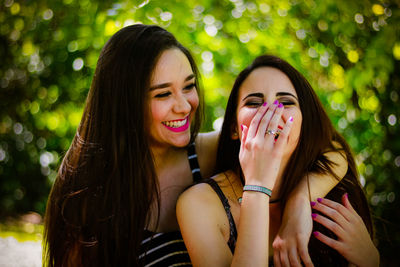 Close-up of laughing young women outdoors