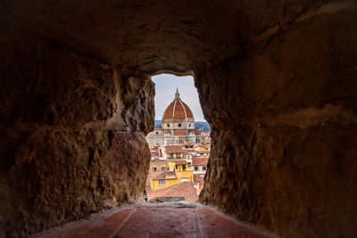 Historic building seen through window