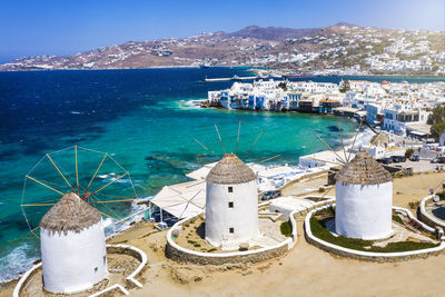 High angle view of buildings by sea