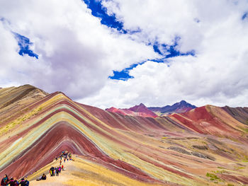 Scenic view of mountains against cloudy sky