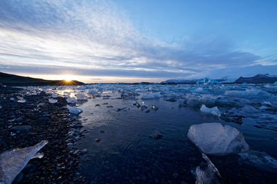 Scenic view of sea against sky during winter