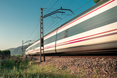 Long exposure with a low angle view of train against sky.