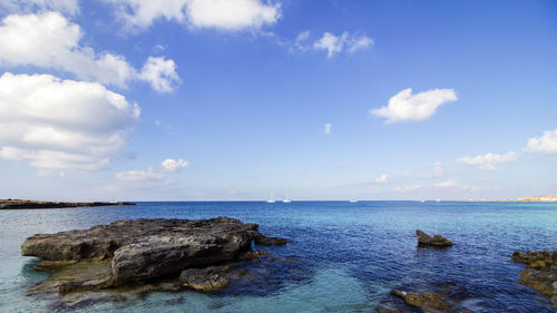 Scenic view of calm sea against sky