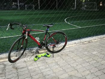 Bicycle parked in grass