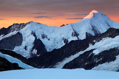 Scenic view of snow covered mountain against sky during sunset at swiss alps