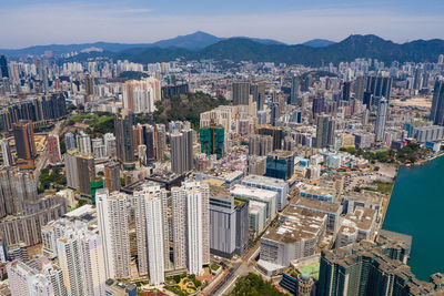 High angle view of modern buildings in city against sky