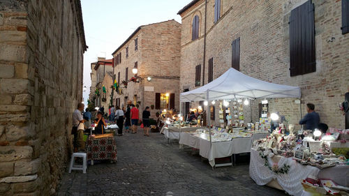 People at sidewalk cafe in city