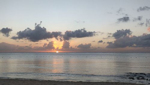 Scenic view of sea against sky at sunset