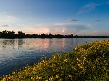 Scenic view of lake against sky during sunset