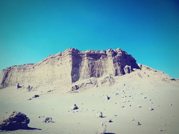 Scenic view of mountain range against clear blue sky