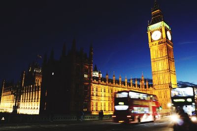 Clock tower in city at night