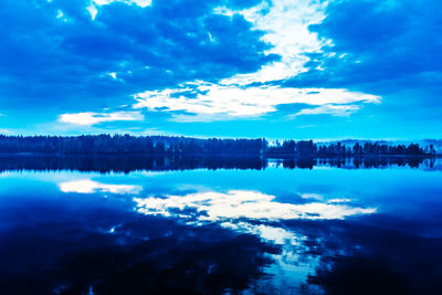 Reflection of clouds in calm lake