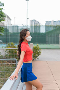 Side view of woman wearing face mask during pandemic