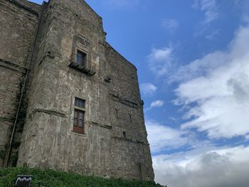 Low angle view of old building against sky