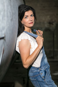 Portrait of smiling young woman standing outdoors