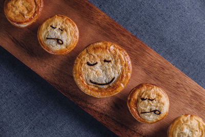 High angle view of muffins on cutting board