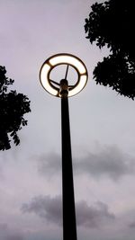 Low angle view of street light against sky