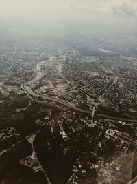 High angle view of city and buildings against sky