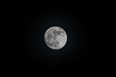 Low angle view of moon against sky at night