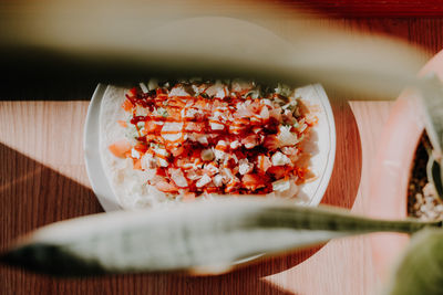 Cropped hand of woman holding food