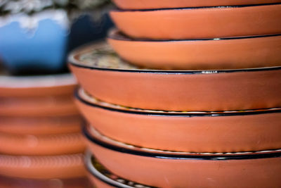 Close-up of stacked plates at market stall