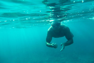 Man swimming in sea