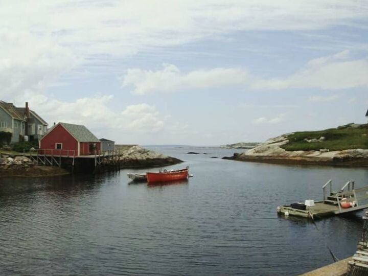 BOATS MOORED IN RIVER