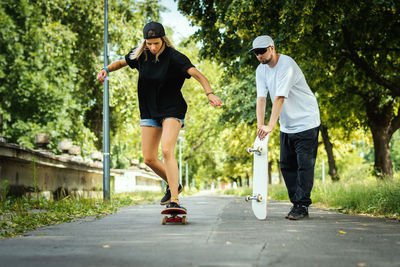 Full length of woman on skateboard