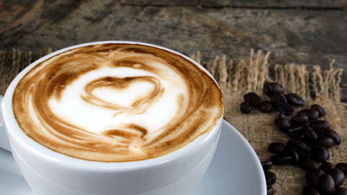 Close-up of cappuccino on table