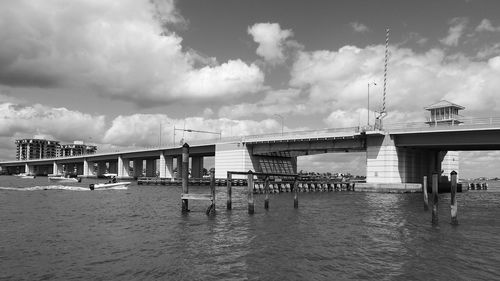 View of pier on sea against cloudy sky