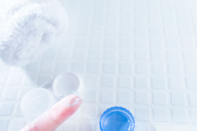 Close-up of hand holding white paper