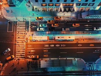 Cars moving on illuminated railroad station