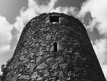 Old windmill in the countryside and sky, black and white photography