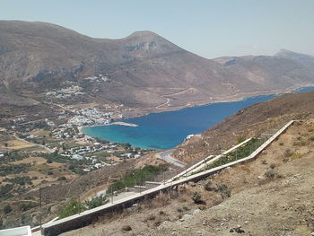 High angle view of road by mountains against sky