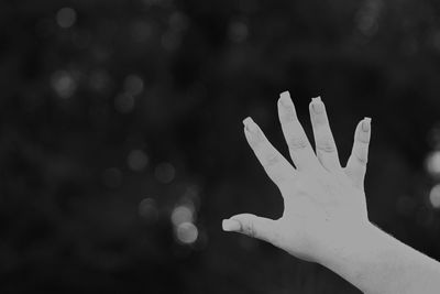 Close-up of hand against blurred background