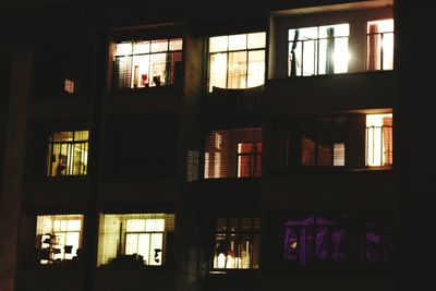 Illuminated building seen through window