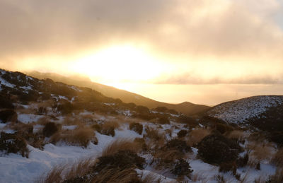 Scenic view of mountains against sky during sunset