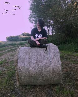 Young woman sitting on grass