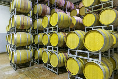 Metal silos for the fermentation of wine inside a farm. storage of wine in the cellar