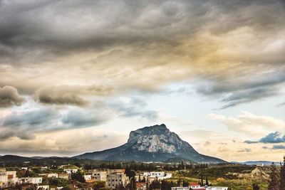 Scenic view of mountains against cloudy sky
