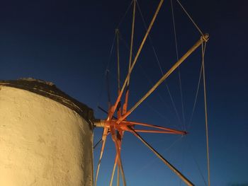 Low angle view of electricity pylon against clear sky at night