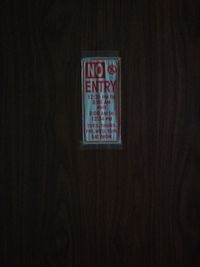 Close-up of clock on wood