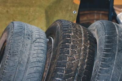 Three auto tires in a row