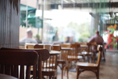 Empty chairs and table in restaurant