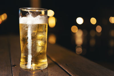 Close-up of beer glass on table