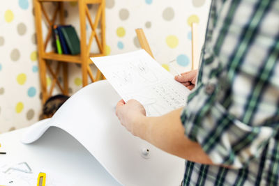 Midsection of woman reading book