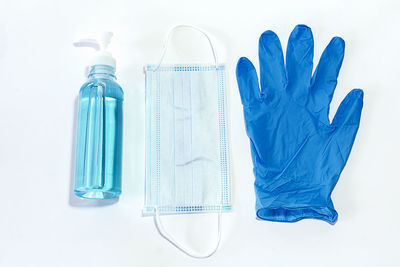 High angle view of blue bottle against white background