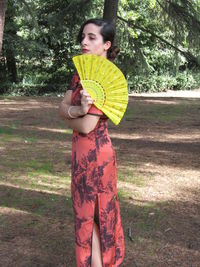 Full length of woman standing on field