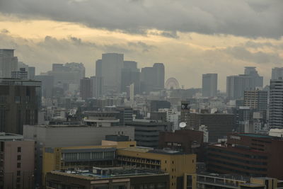 High angle view of buildings in city against sky