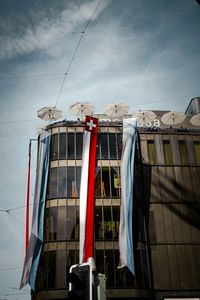 Low angle view of clothes drying against building